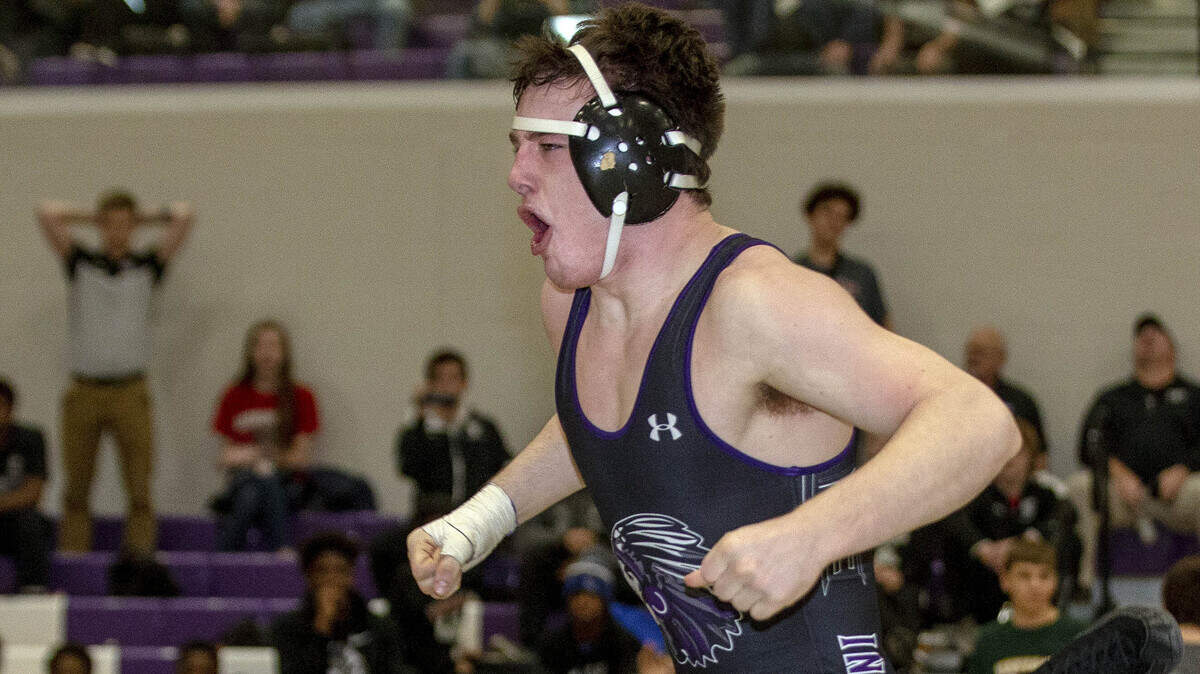 February 15, 2020 - Mascoutah, IL - Mascoutah’s Caleb Grau celebrates after pinning Carbondale’s Luke Daly at 7:58 of overtime in the 170-pound title match at the Class 2A Mascoutah Sectional. [Photo: Chris Johns]