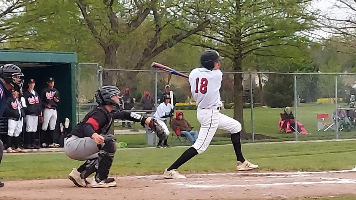 Highland outfielder Tyler Griesbaum rips a shot toward second base during a Mississippi Valley Conference game against rival Triad earlier this spring. Griesbaum helped the Bulldogs post a strong season in which they reached the regional championship and won 26 games.