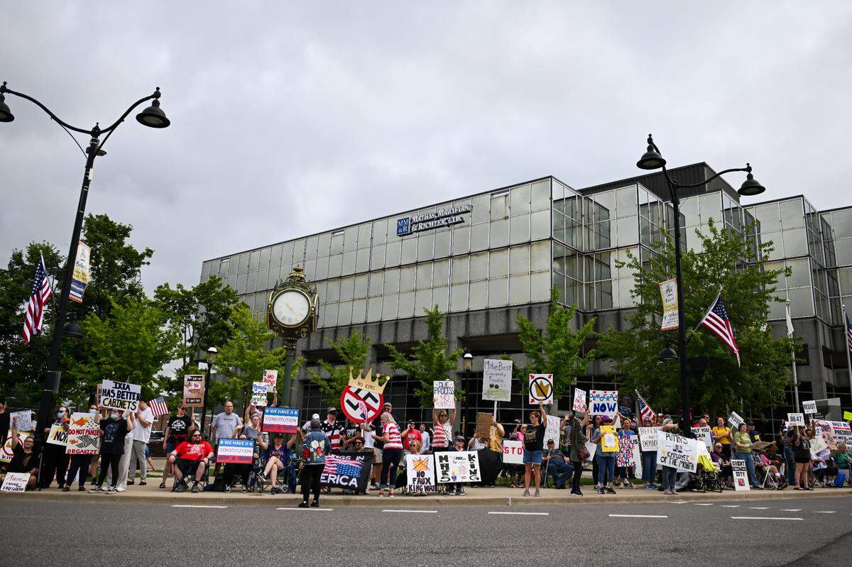 Protesters rally against President Donald Trump at the “No Kings” protest in Belleville’s Public Square Saturday, June 14, 2025.
