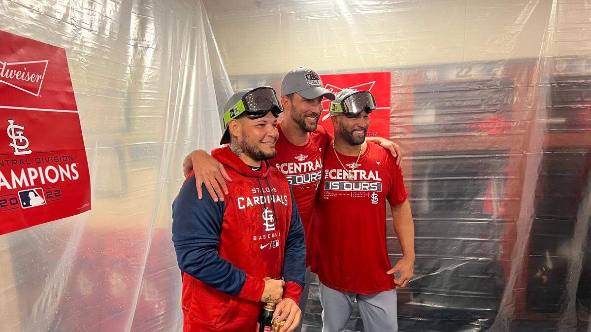 St. Louis Cardinals stars Yadier Molina, Adam Wainwright and Albert Pujols are all smiles following the team’s 6-2 win against Milwaukee on Tuesday night. The victory secured the organization’s 12th Central Division crown.