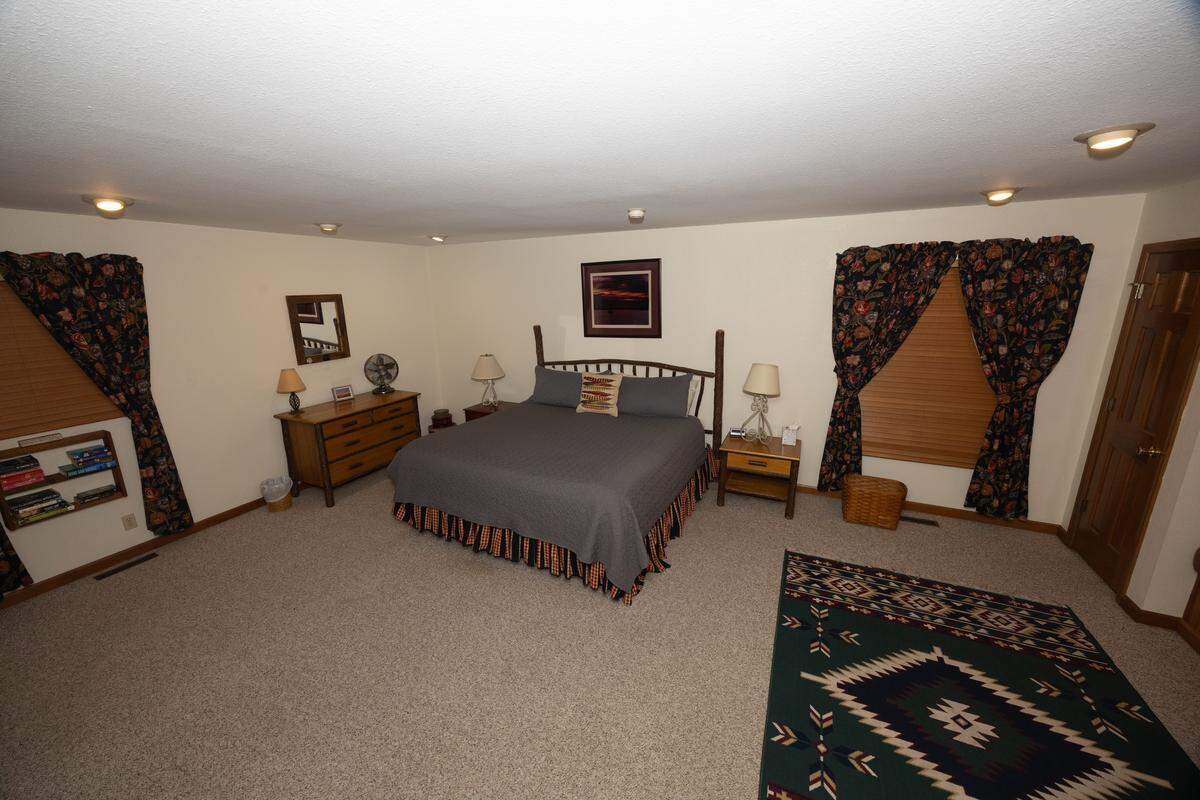 The main bedroom of a cabin at Tara Point Inn.
