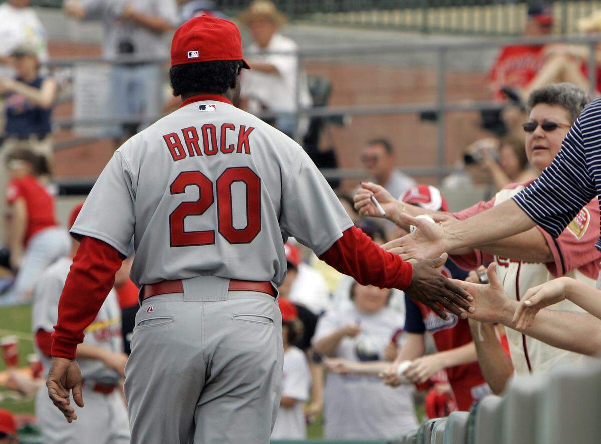 Former St. Louis Cardinals great and hall of famer Lou Brock greets fans as he leaves a spring training baseball game against the Florida Marlins  Wednesday, March 12, 2008.