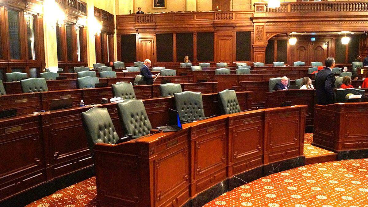 The Republican side of the Illinois House sits empty on Wednesday as Democrats debate resolutions condemning recent executive orders and actions by President Donald Trump’s administration.