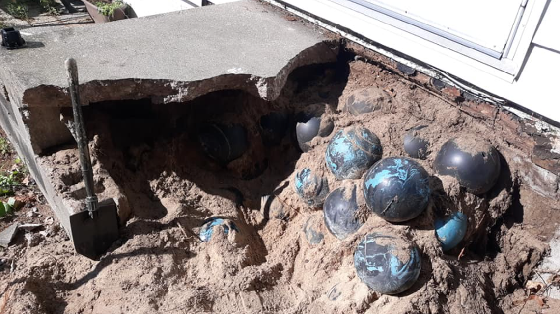 A Michigan man’s home improvement project became mysterious when he discovered a seemingly endless pile of bowling balls buried under his porch.