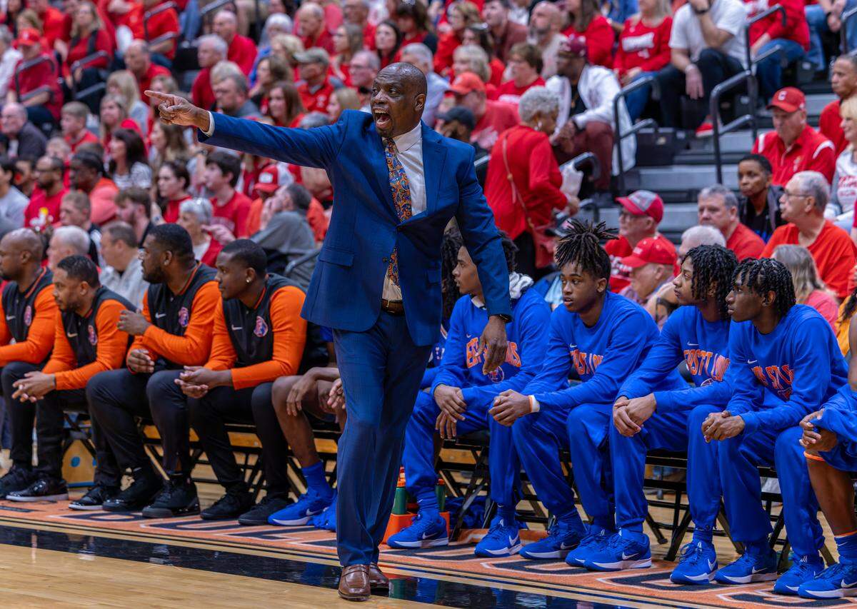 East St. Louis coach Mark Chambers paces the bench during the Flyers’ win over Centralia in the Waterloo Sectional championship game Friday.