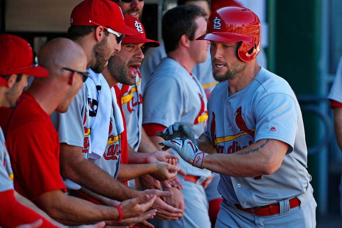 Former St. Louis Cardinal Matt Holliday, right, celebrates with teammates in the dugout after hitting a solo home run against Pittsburgh in 2016. Holliday, the Cardinals Hall of Famer who was announced as the team’s new bench coach Nov. 6, has resigned that position.