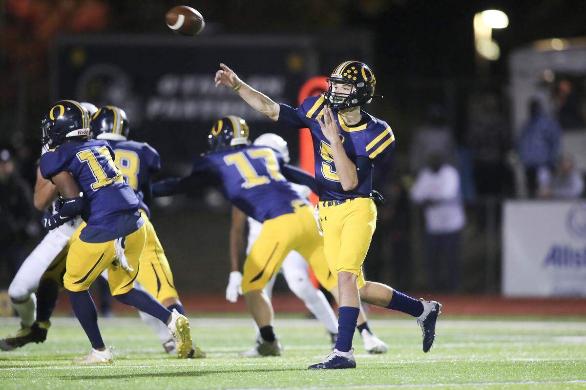 O’Fallon quarterback Colt Michael attempts a pass during Saturday night’s IHSA Class 8A playoff game against Edwardsville. The Panthers fell to the Tigers 43-36.