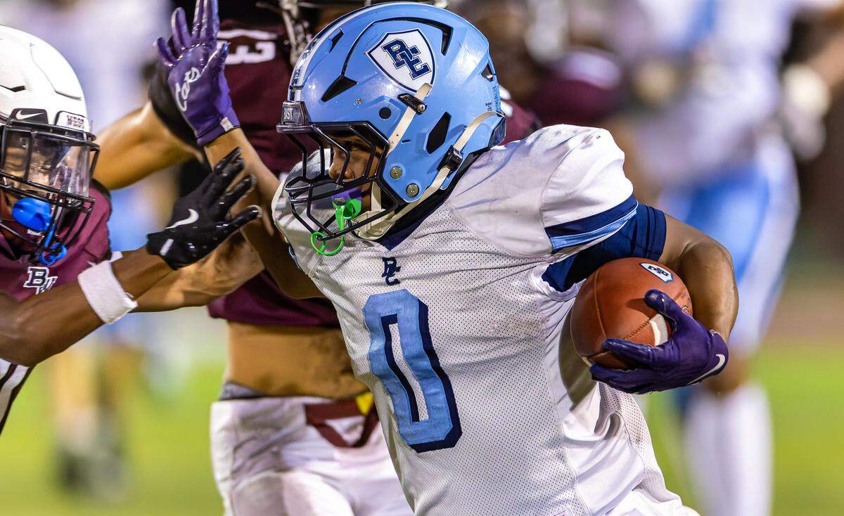 East’s Jaedon Beamon in action against cross-town rival Belleville West Friday at Goalby Field.