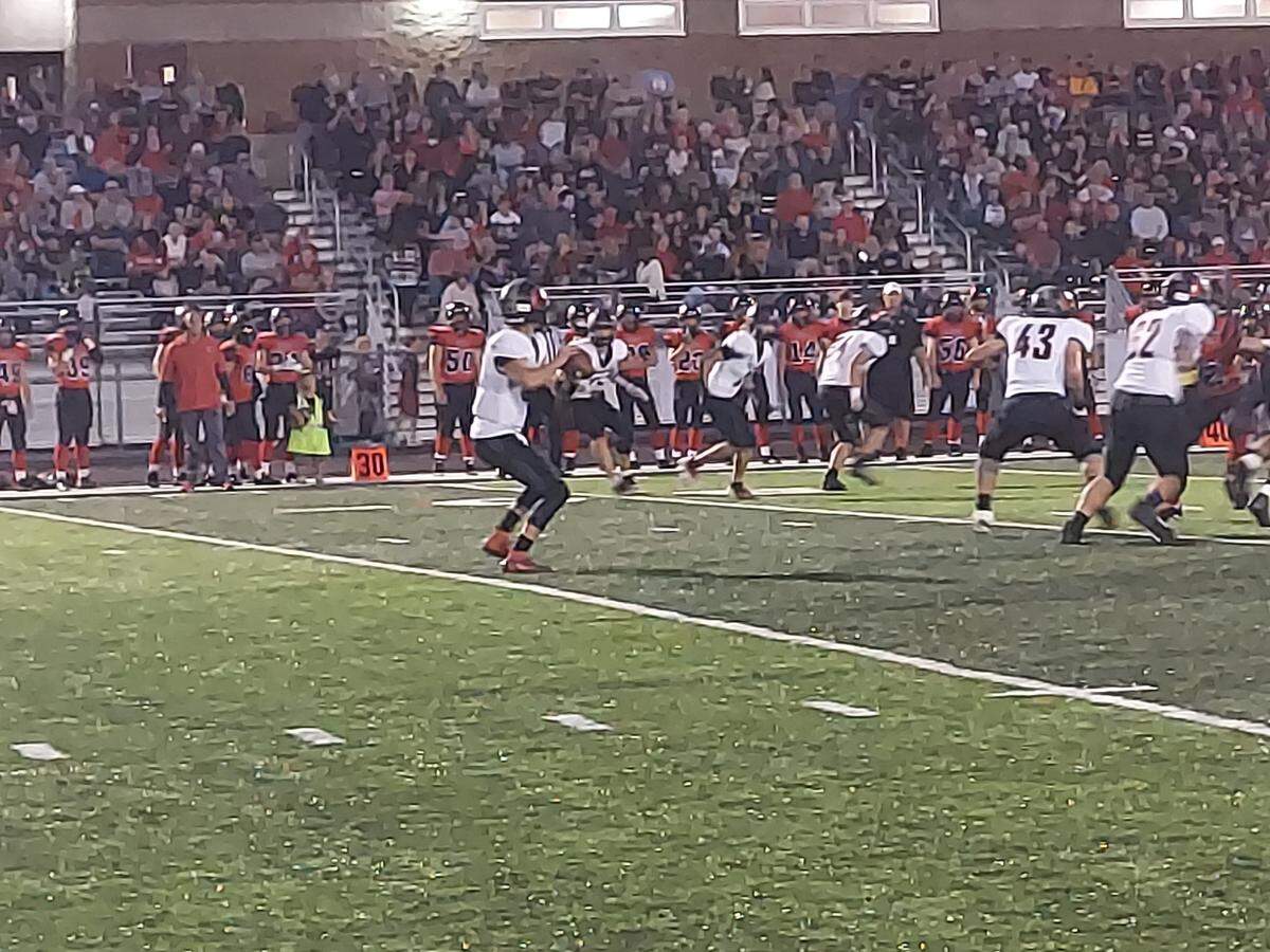 Highland quarterback Brent Wuebbles sets up to pass during a Mississippi Valley Conference game against Triad last season. Wuebbles threw for three touchdowns in helping lead the Bulldogs to a 54-10 triumph in their 2022 season opener.