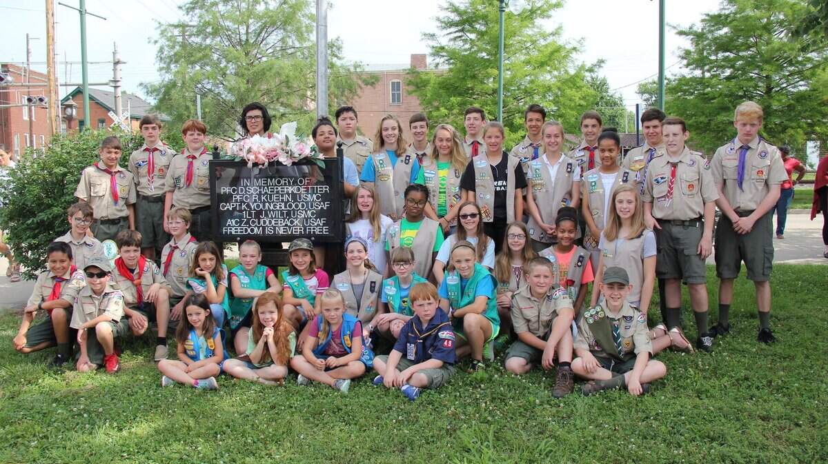 Multiple Girl Scout and Boy Scout troops participated in the O'Fallon Woman's Club golden anniversary of Memorial Corner Saturday morning at the corner of S. Lincoln Avenue and First Street. Memorial Corner has been honoring fallen veterans from O'Fallon monthly since 1968. The monthly tradition includes a flag-raising ceremony, singing the national anthem and a reading of a brief biography of the local fallen hero by a local scout, and is sponsored by the O'Fallon Woman's Club.