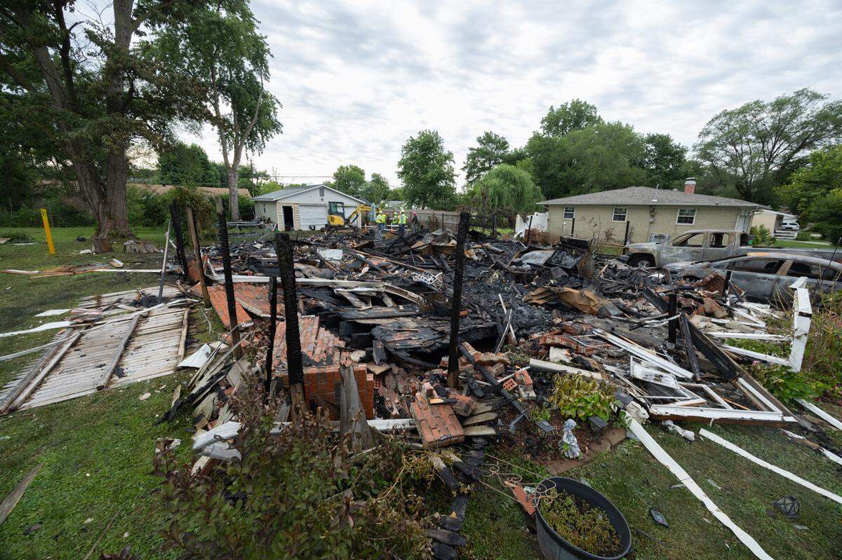 At the site of a house explosion outside of Collinsville on Monday.