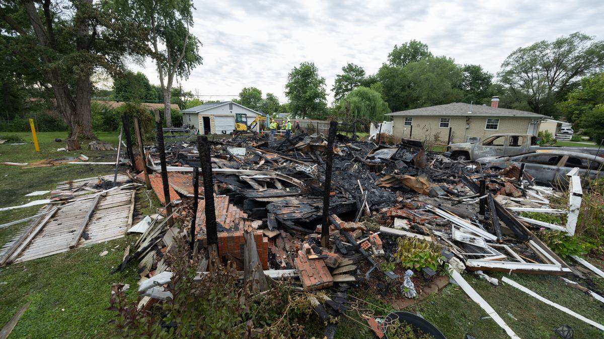 At the site of a house explosion outside of Collinsville on Monday.