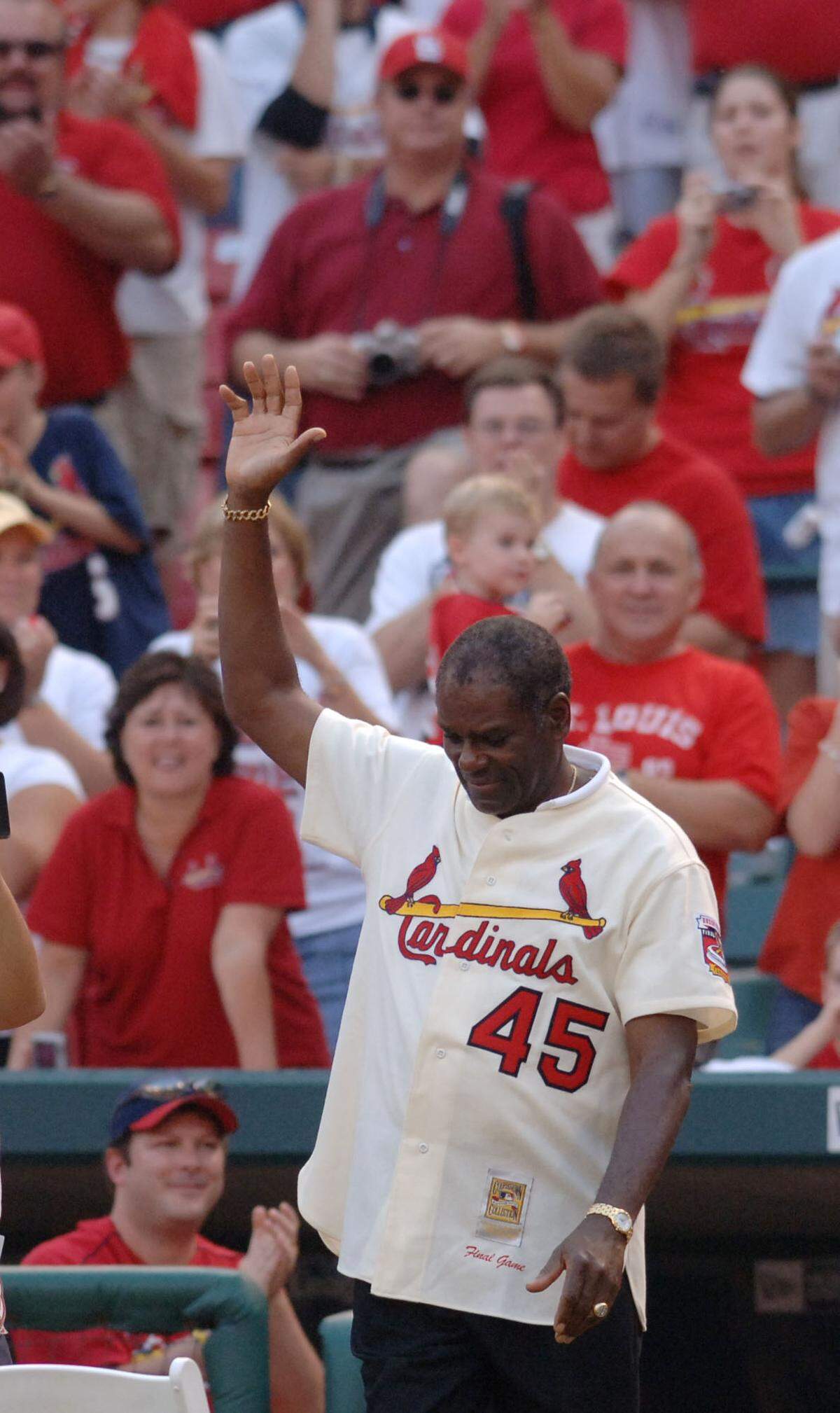 St. Louis Cardinals Hall-of-Famer Bob Gibson waves to the crowd during ceremonies following the Cardinals last regular-season game at Busch Stadium, Sunday, Oct. 2, 2005.
