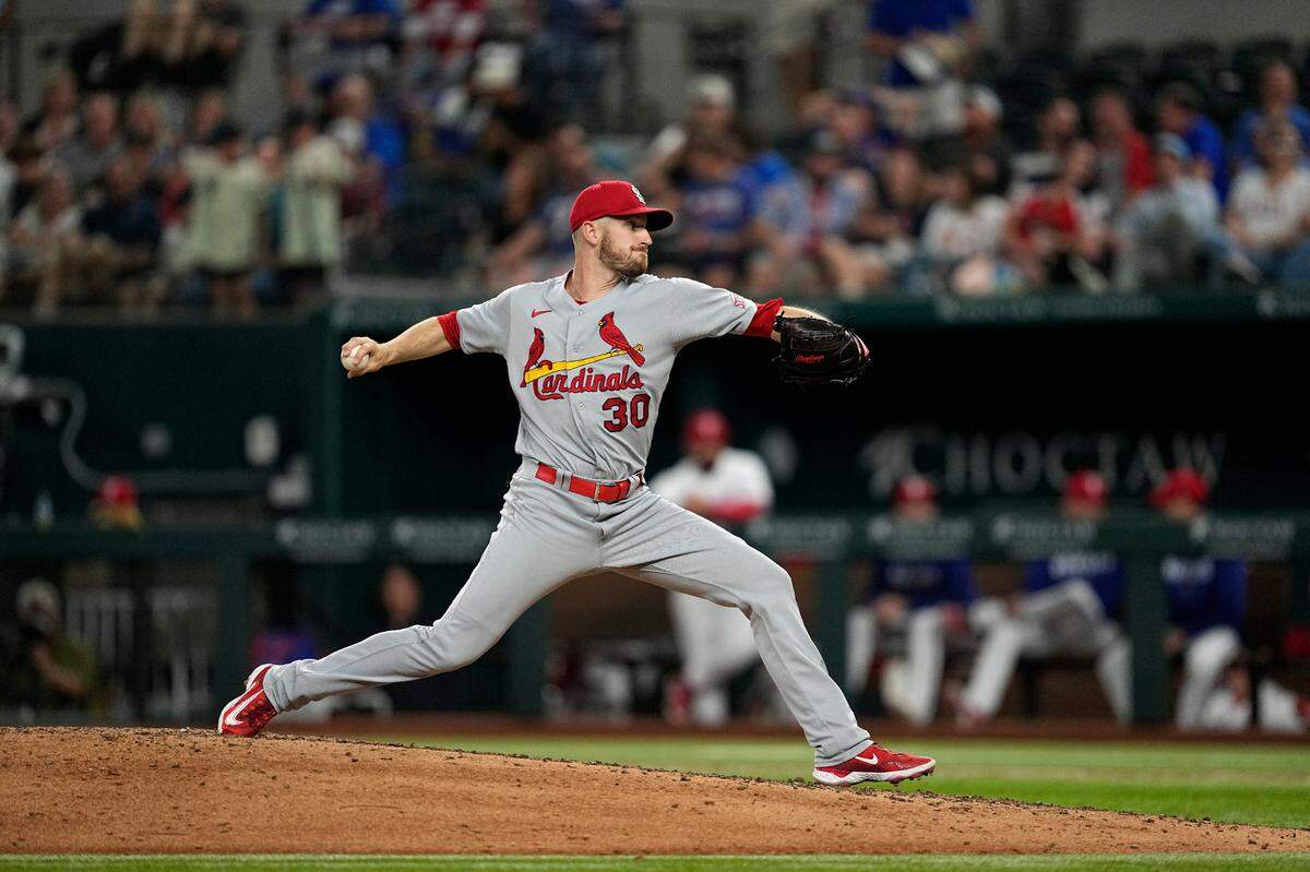 St. Louis Cardinals relief pitcher Chris Stratton throws to the Texas Rangers during a baseball game, Tuesday, June 6, 2023, in Arlington, Texas. Stratton will be joining the Rangers as part of a trade with the Cardinals.