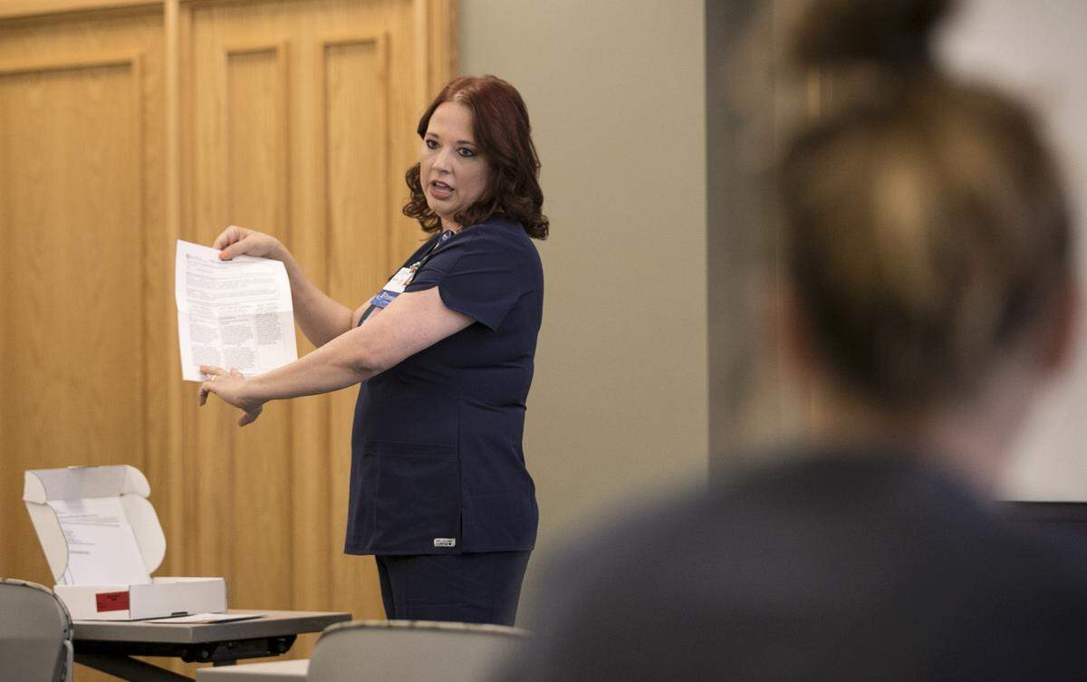 Amy Signore, a nurse at St. Elizabeth’s Hospital in O'Fallon, leads a session at sister hospital St. Joseph's in Breese about how nurses can be trained to treat sexual-assault victims.