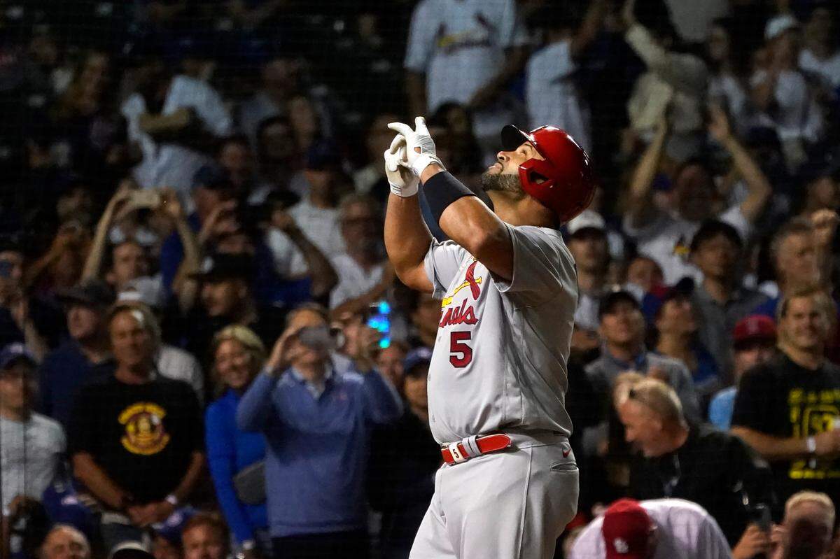 St. Louis Cardinals slugger Albert Pujols celebrates his 693rd career home run off Chicago Cubs starting pitcher Drew Smyly during the seventh inning Monday, Aug. 22, in Chicago. It represented the 449th pitcher off of whom he has hit a home run, tying Barry Bonds’s Major League record.