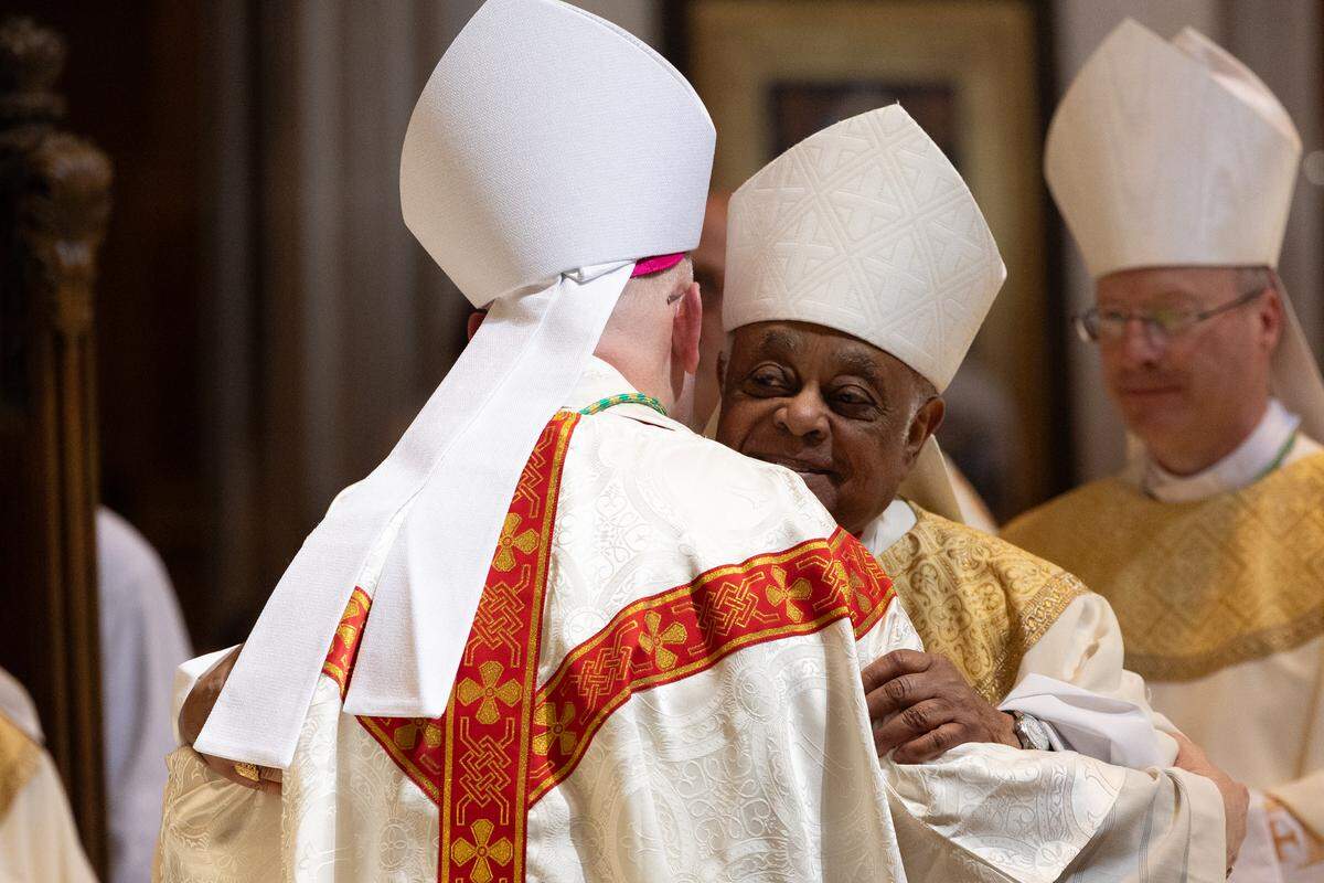 Cardinal Wilton Gregory, former bishop of Belleville from 1994 to 2004, embraces newly installed Bishop Godfrey Mullen during Mullen’s installation at the Cathedral of St. Peter on Friday.