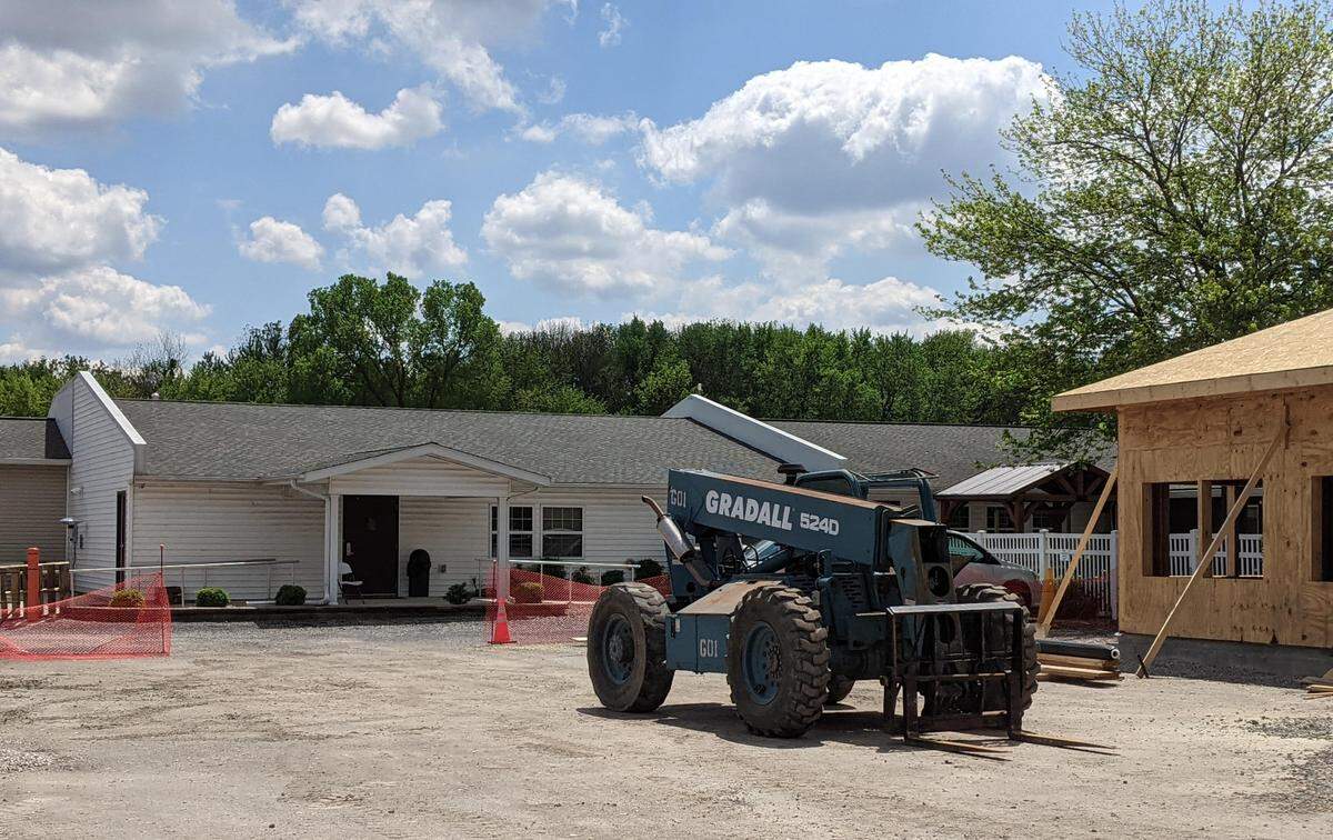 The original Clinton Manor building sits behind the newest addition. Multiple additions to the nursing home have been built since 1990.