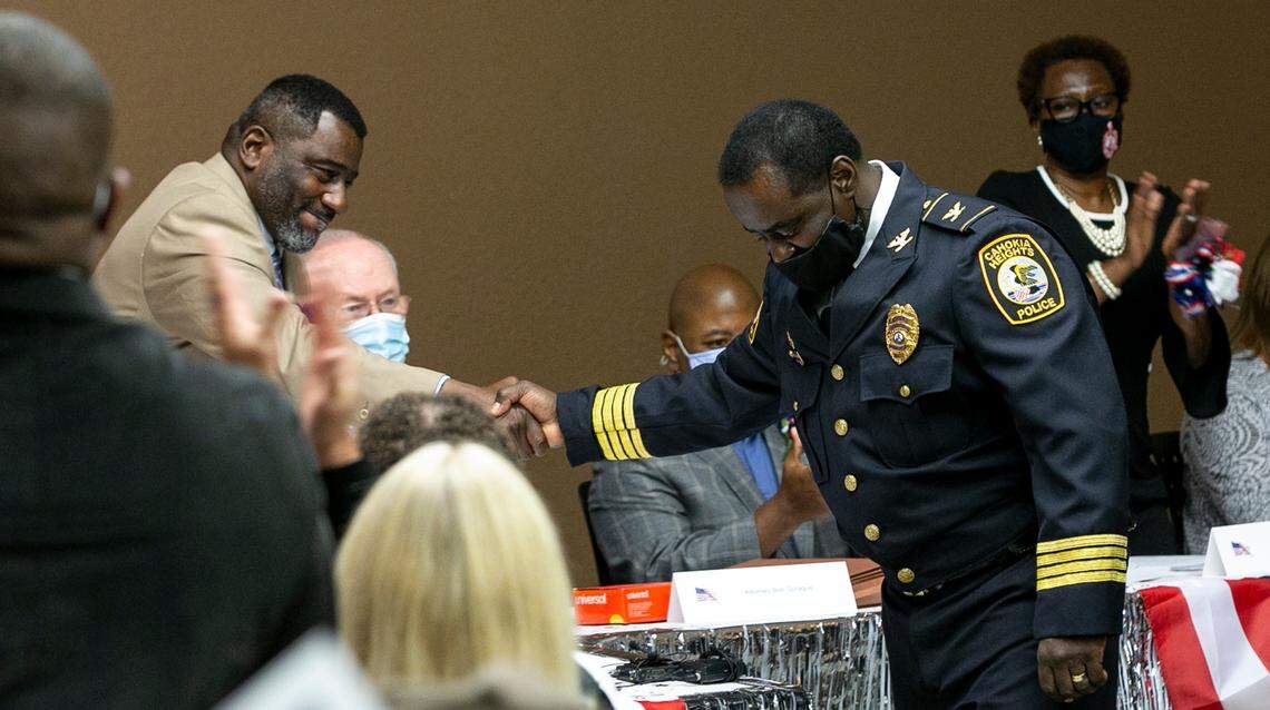 Curtis McCall Sr, the first mayor of Cahokia Heights, congratulates the new police chief of Cahokia Heights Steve Brown.