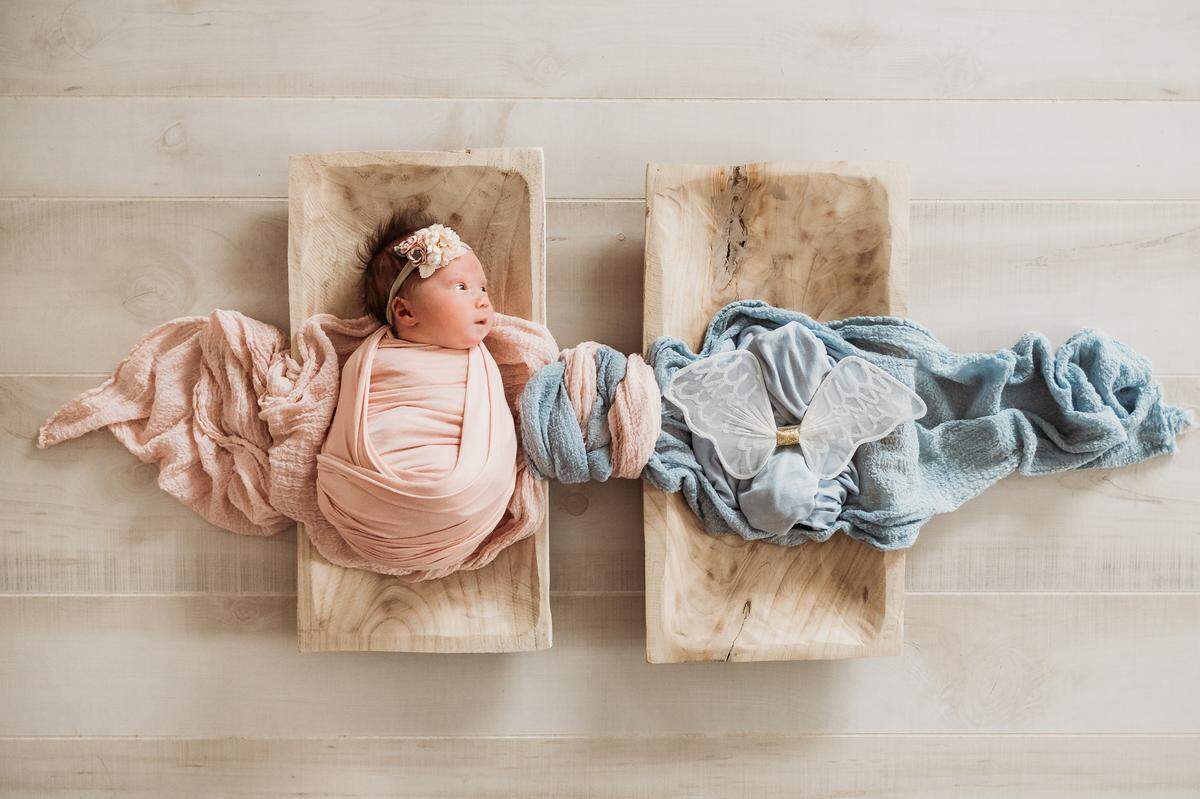 Jessica Young’s love for the job spills over into each photo session, and a recent photo by Young captured the heart of a St. Louis mother experiencing both joy and grief after giving birth to twins.