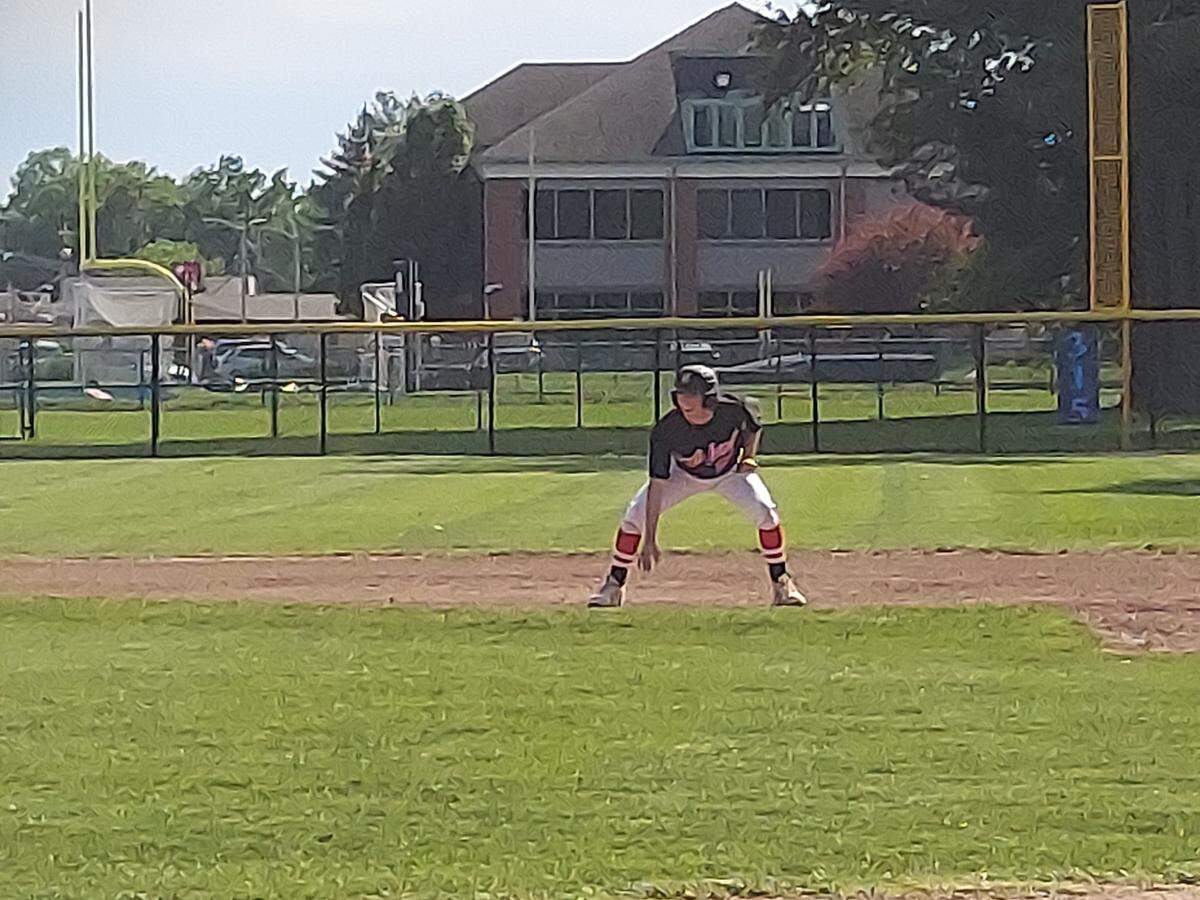 Highland’s Jake Ottensmeier takes a lead from first base during a non-conference game against host Belleville East on Monday, May 23. Ottensmeier blasted a two-run homer while going 4-for-4 in helping lead the Bulldogs to a 9-6 victory.