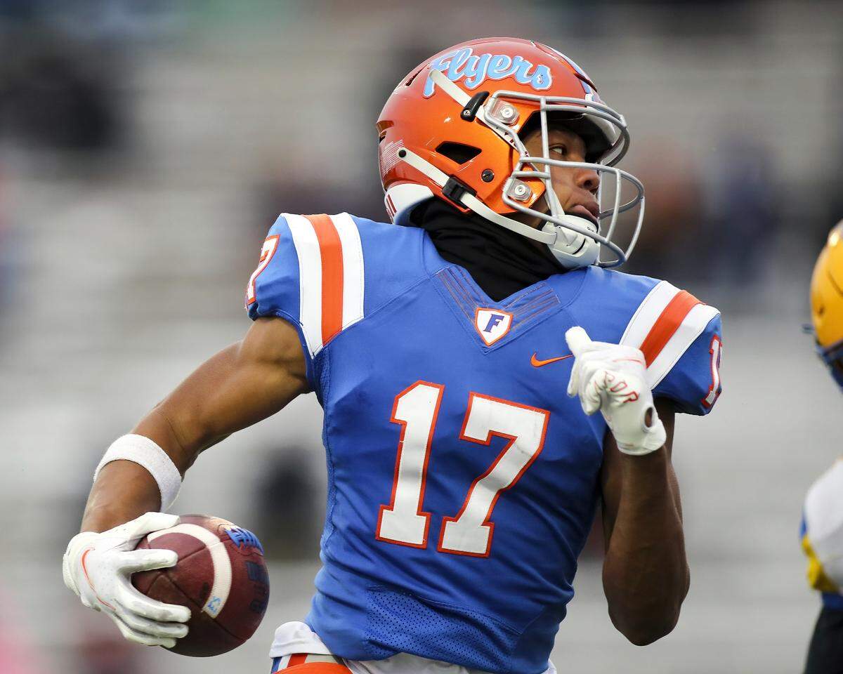 November 12, 2022 - East St. Louis, IL - East St. Louis Dejerrian Miller carries the ball during the IHSA, 6A, Quarterfinal playoff game between Crete - Monee and East St. Louis. The 45-0 victory will advance the Flyers to the Semifinals. [Photo: Chris Johns]