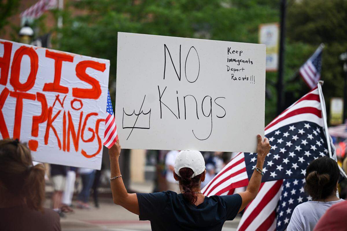 Protesters rally against President Donald Trump at the “No Kings” protest in Belleville’s Public Square Saturday, June 14, 2025.