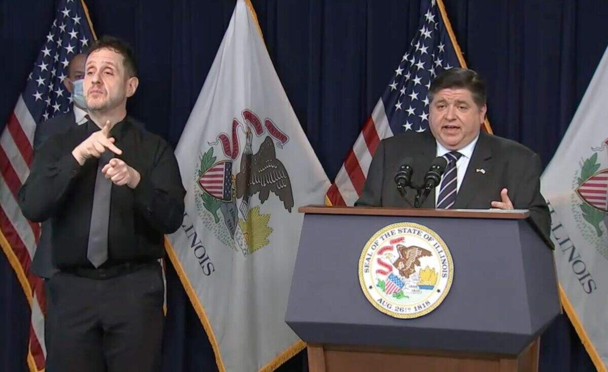 Gov. J.B. Pritzker provides a COVID-19 update during a news conference Monday in Chicago. Pritzker warned hospitalizations are as high as they were last winter before vaccines were readily available to the public.