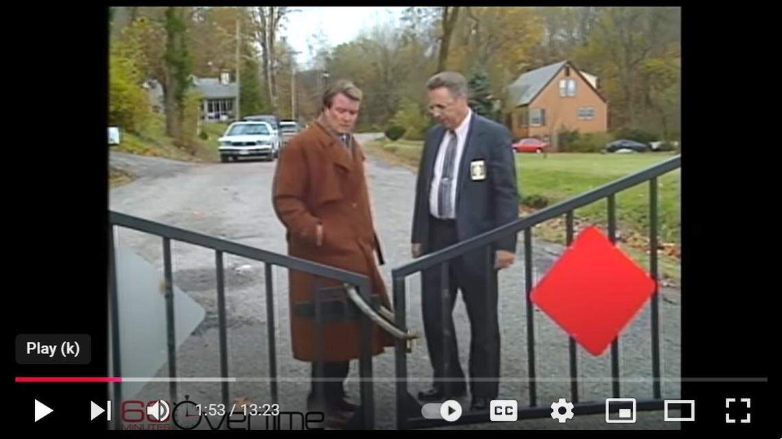 Former Belleville Police Chief Robert Hurst, now deceased, is shown in a video screenshot being interviewed in 1993 by “60 Minutes” correspondent Steve Kroft, now retired, in front of a gate on Kingston Drive in unincorporated Belleville.