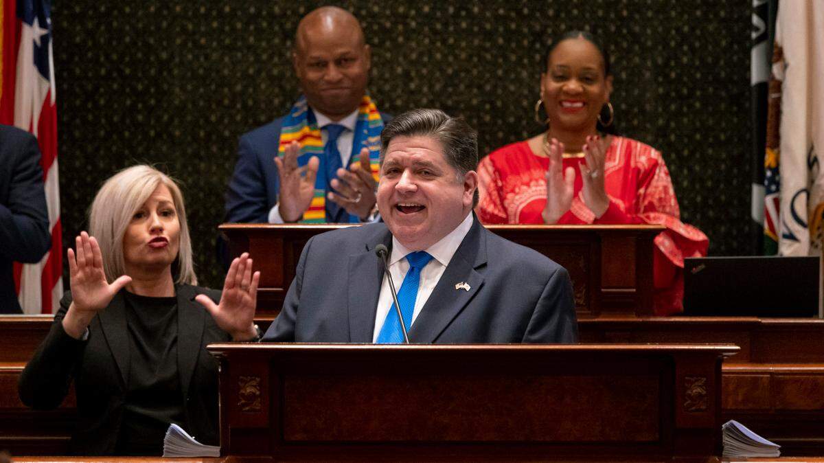 Gov. J.B. Pritzker delivers his combined budget and State of the State address in front of House Speaker Emanuel “Chris” Welch and Senate Majority Leader Kimberly Lightford to a joint session of the General Assembly on Wednesday, Feb. 15, 2023 at the Illinois State Capitol in Springfield, Ill. (Brian Cassella/Chicago Tribune via AP, Pool)