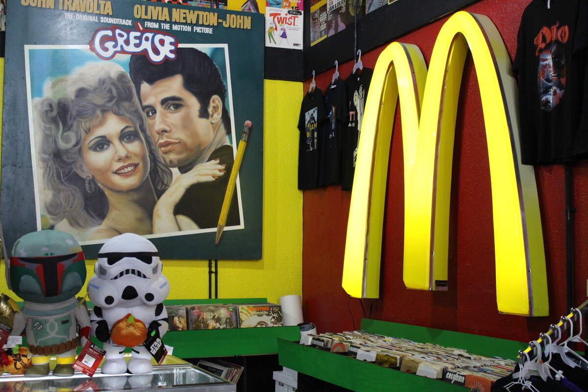 The back display room at Monster Vinyl in Collinsville is dominated by this giant "Grease" movie poster and a pair of golden arches from McDonald's.