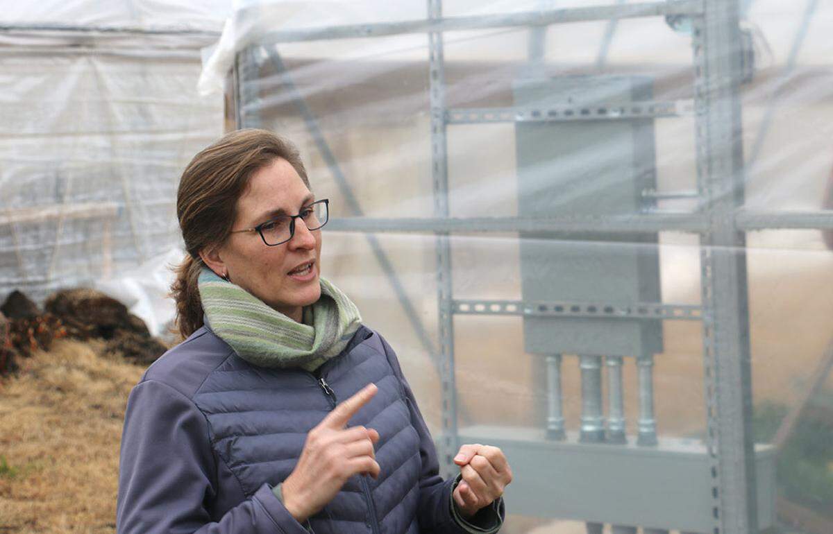 Sola Gratia Director Traci Barkley outlines the farm’s operations and how it benefitted from Illinois’ Local Food Infrastructure Grant program outside a high tunnel at Sola Gratia in Urbana.