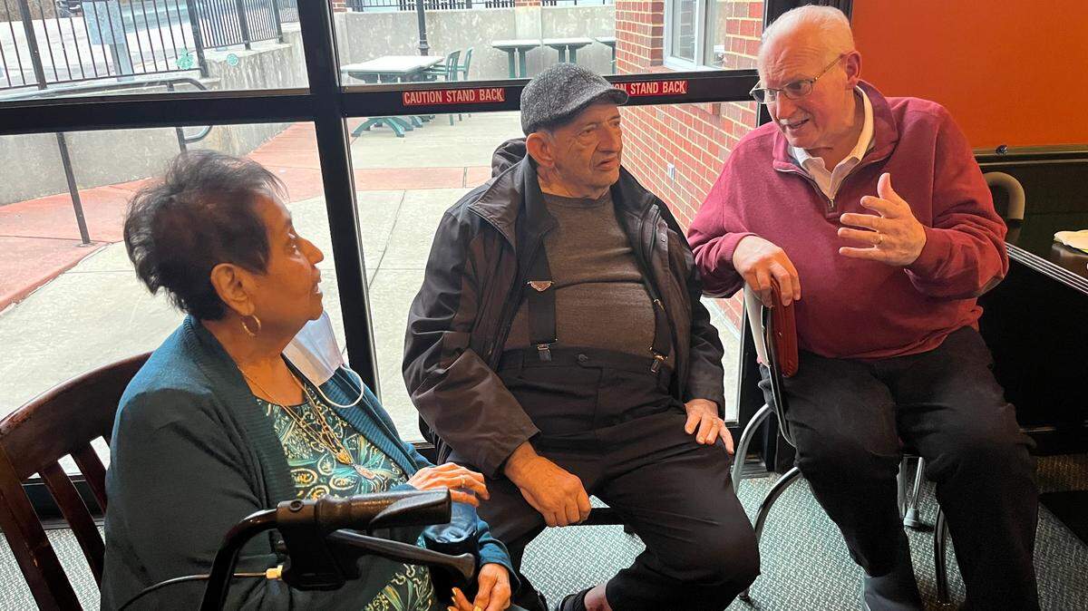 Former Belleville Mayor Mark Eckert, right, visits with his old friend, Joe Hubbard, and Hubbard’s wife, Julie, at Eckert’s 67th birthday party on Sunday afternoon at Cutter’s Bar & Grill.