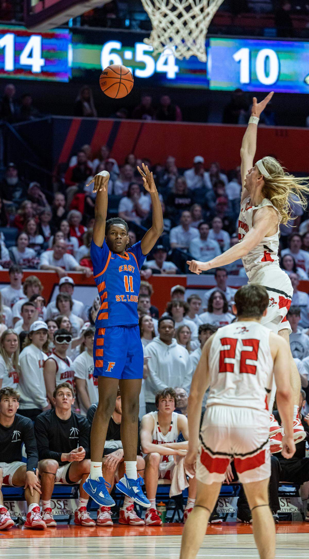 East St. Louis’ Dainen Rucker goes up for a 3-pointer during Friday’s IHSA Class 3A state semifinal game against Metamora at State Farm Center in Champaign on the campus of the University of Illinois. The Flyers ultimately fell to the Redbirds 50-43.