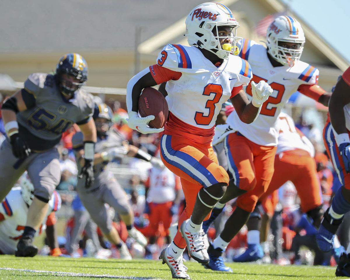 East St. Louis wide receiver Christopher Bennett streaks ahead during Saturday’s Southwestern Conference game against O’Fallon. The Flyers rolled to a 60-21 victory.