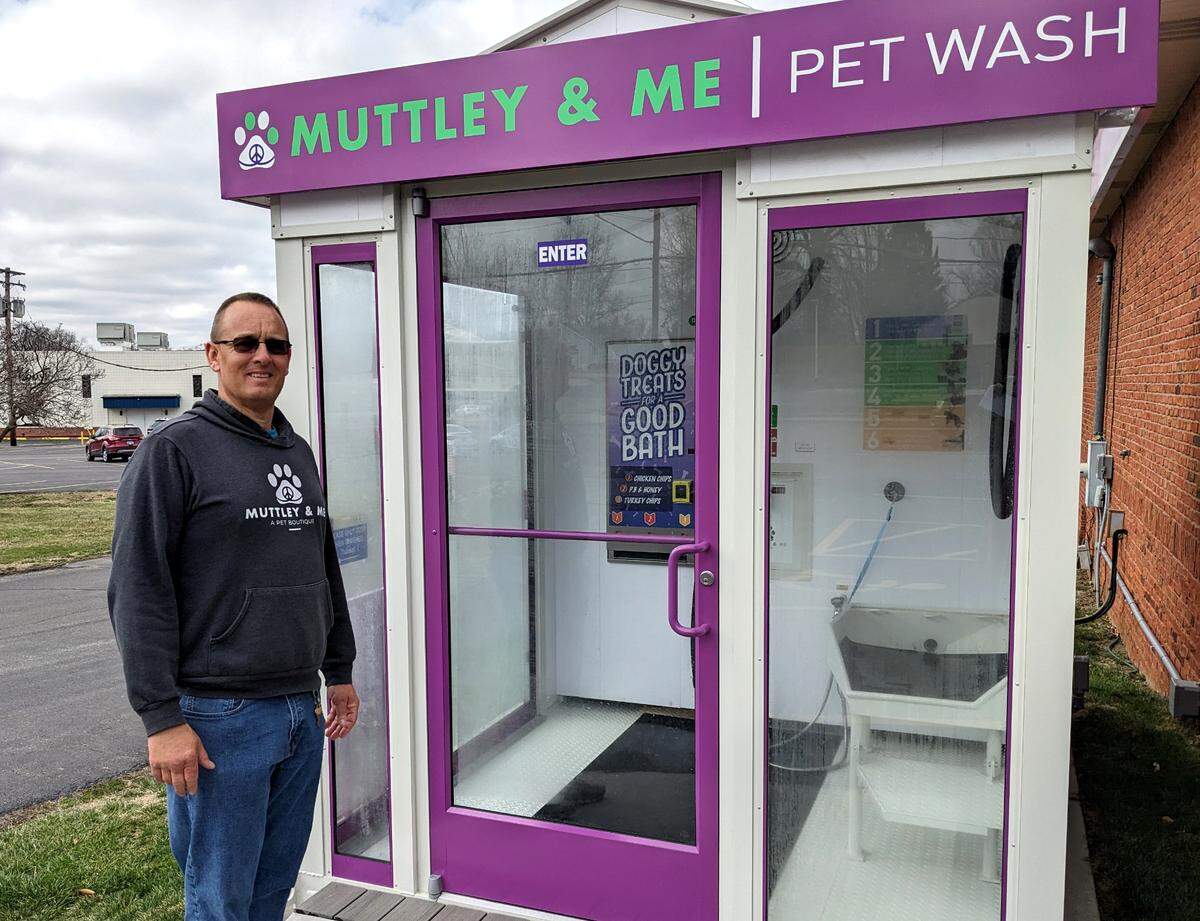 Muttley & Me owner Jason Keck stands by the pet boutique’s new self-service pet wash.