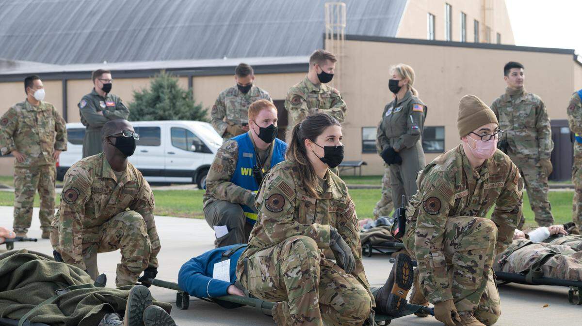 Airmen from the 375th Aeromedical Evacuation Squadron prepare to lift a simulated injured patient during an exercise on Scott Air Force Base The exercise was designed to prepare Airmen for real-world medical evacuations.