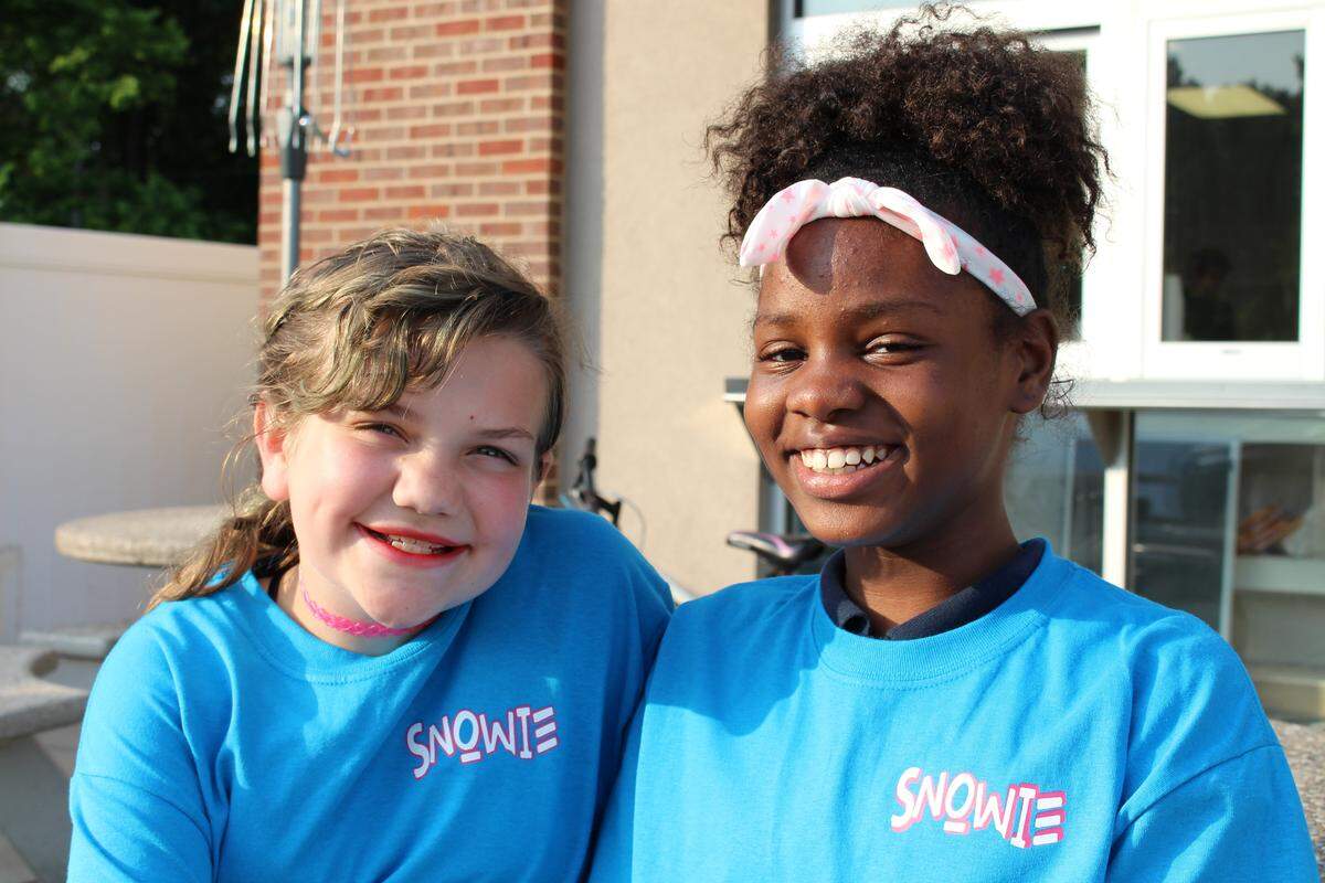 Alyssa Hardt, 10, and Amila Lewis, 11, of Belleville, are such regular customers at Snowie Sweet Treats that the owner gave them T-shirts in appreciation.