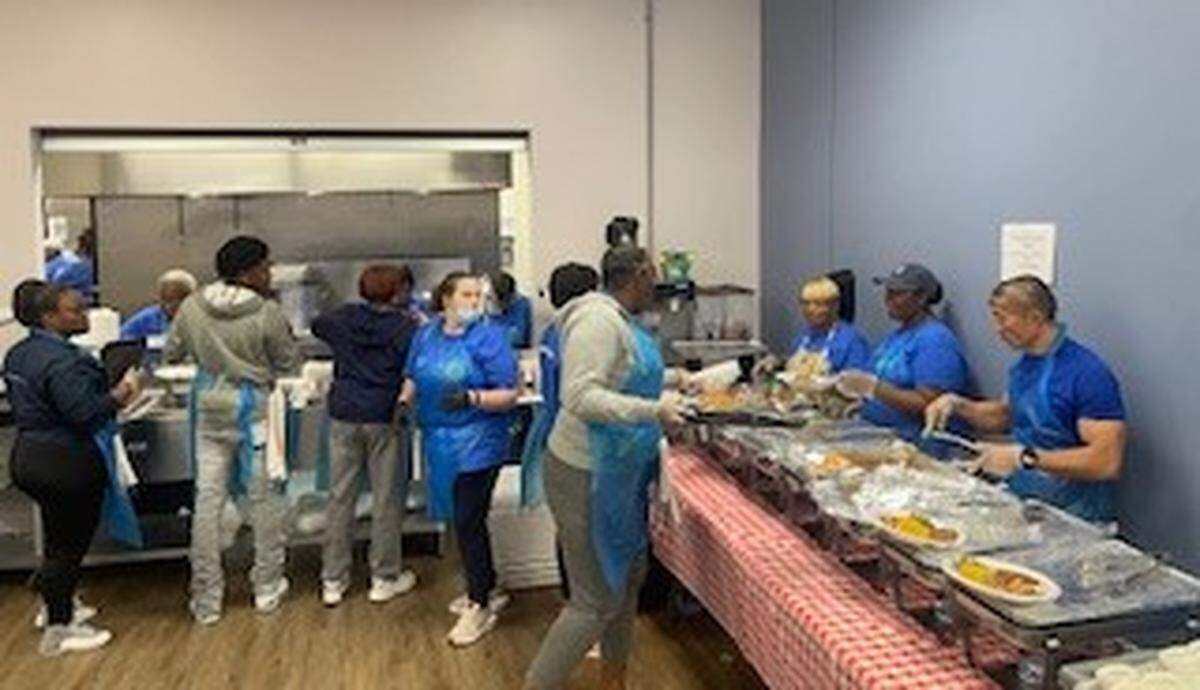 AmeriCorps workers help operate the Seasoned Circle Cafe, a program of Lessie Bates Davis Neighborhood House in East St. Louis. It provides nutritional meals and social opportunities for senior citizens.