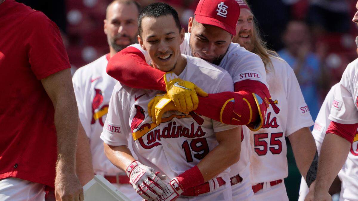 Tommy Edman (19),is congratulated by teammates after delivering the winning hit in the St. Louis Cardinals win over San Diego Wednesday at Busch Stadium. It was the second day in a row an Edman hit gave the home team a walk-off win.