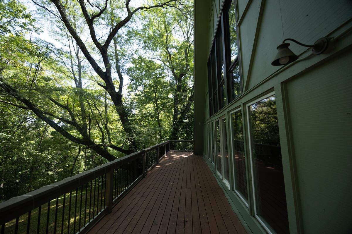 A wrap-around porch provides panoramic views around the property. The windows along the back of the home allows the views to be brought inside.