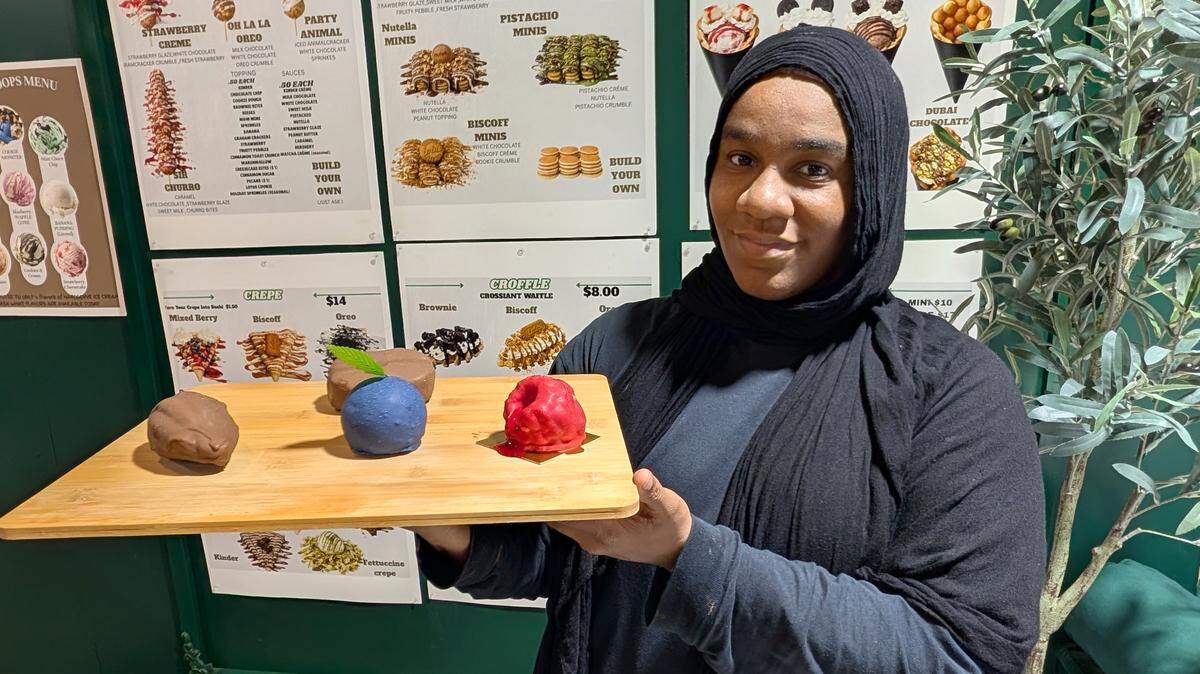 Ameena Almasri, the owner of The Sweet Creamery, shows off some of the fruit pastries on offer.