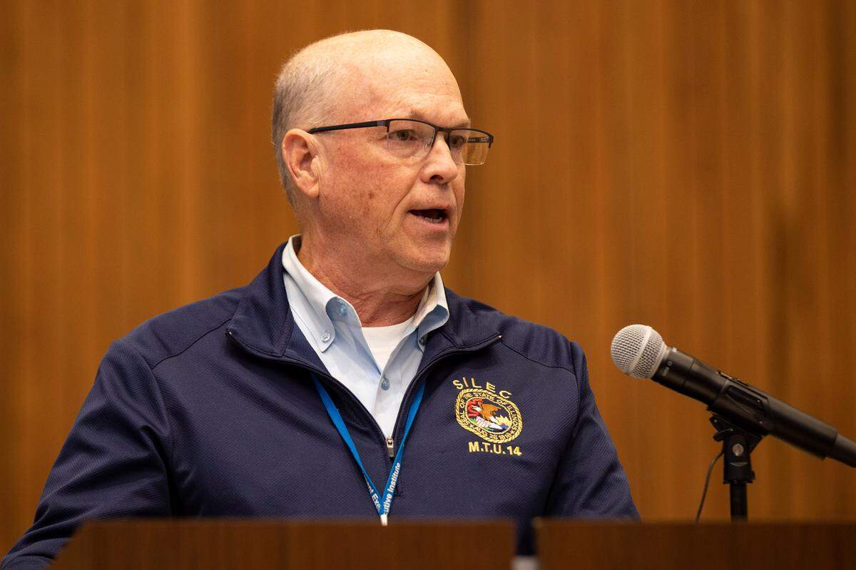 Southern Illinois Law Enforcement Commission Director David Hayes speaks at a press conference Monday after a special Belleville City Council meeting in which alderman approved four tenant agreements for the former Lindenwood University campus.
