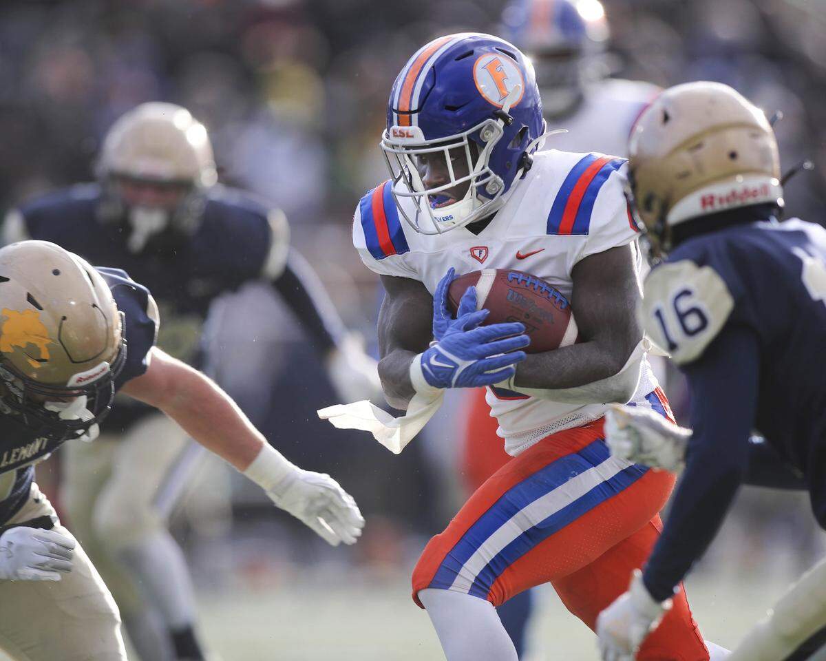 East St. Louis running back TaRyan Martin carries the ball during the IHSA Class 6A semifinals against Lemont. Martin helped lead the Flyers to a 32-29 victory and a spot in the state championship game.