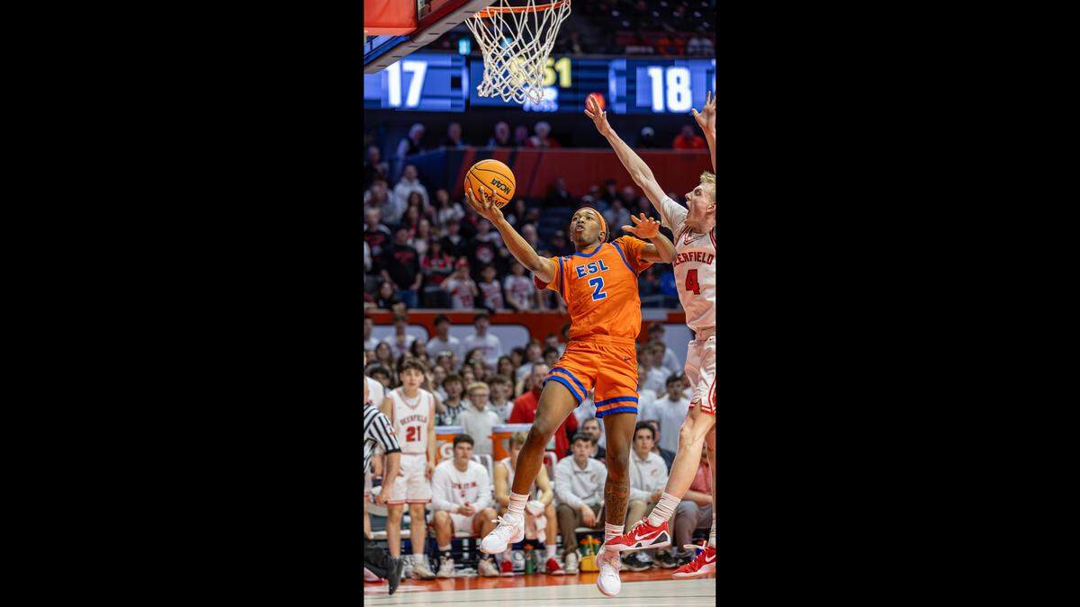 Alex Johnson drives for a score against Deerfield in the championship game of the IHSA Class 3 State Tournament in Champaign Saturday.