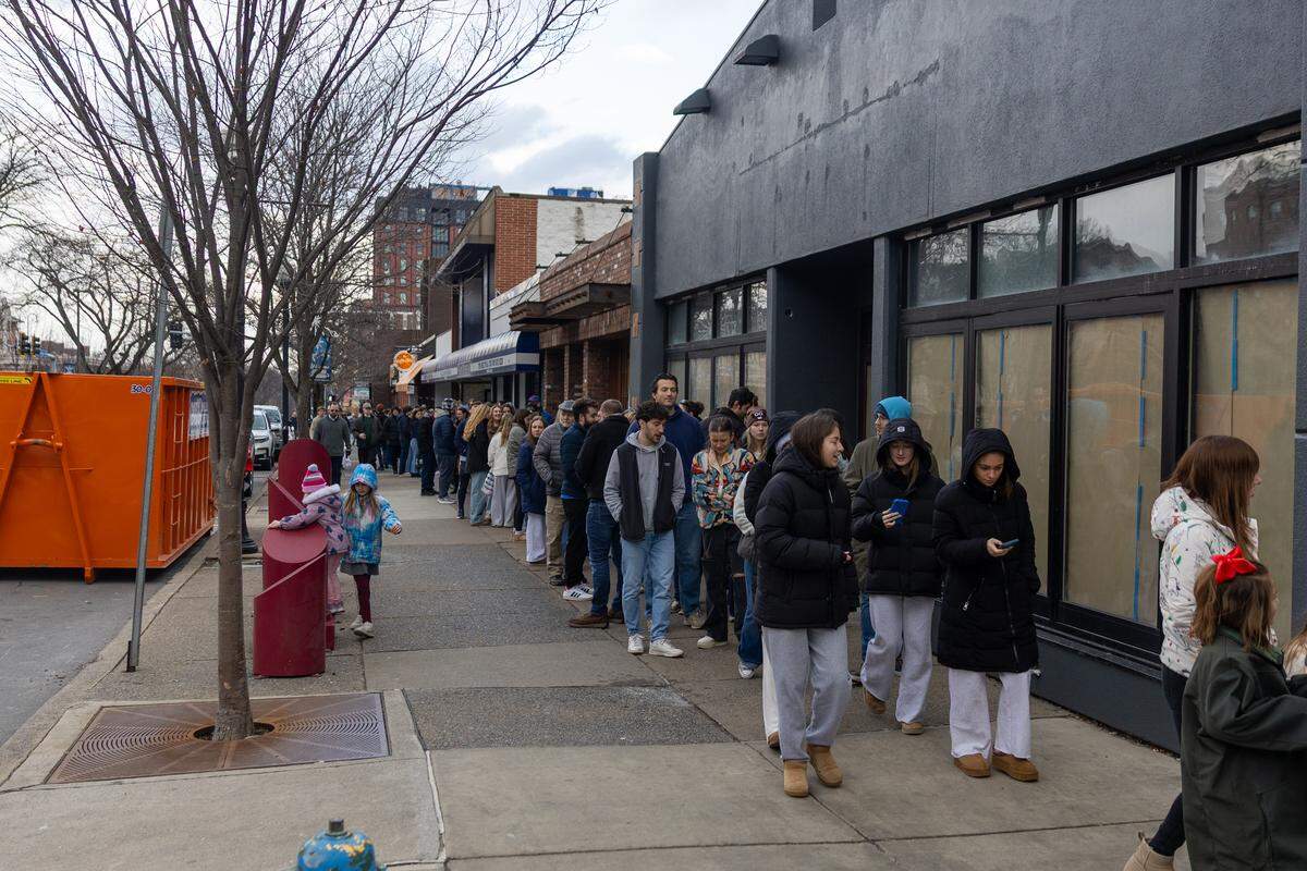 The line to enter The Press Cider and Craft Beverage Tap House and take photos with Punxsutawney Phil is seen wrapping around the opposite end of the block on Saturday, Jan. 17, 2026 in State College.