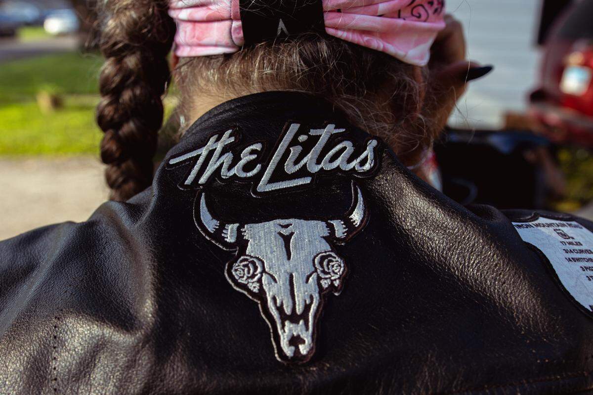 Tina Weber wears a leather vest sporting “The Litas” logo on Sunday, July 14, 2024, in Collinsville, Illinois. The group is a global, all-female motorcycle group, empowering women to “raise a little hell and ride.”