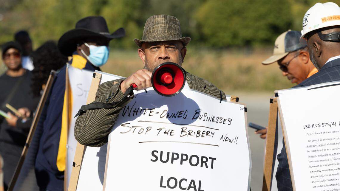 Don Johnson, owner of SRM Construction Material & Supply, a Cahokia Heights, Ill. business, leads a demonstration in front of the future home of a new Cahokia Heights school.