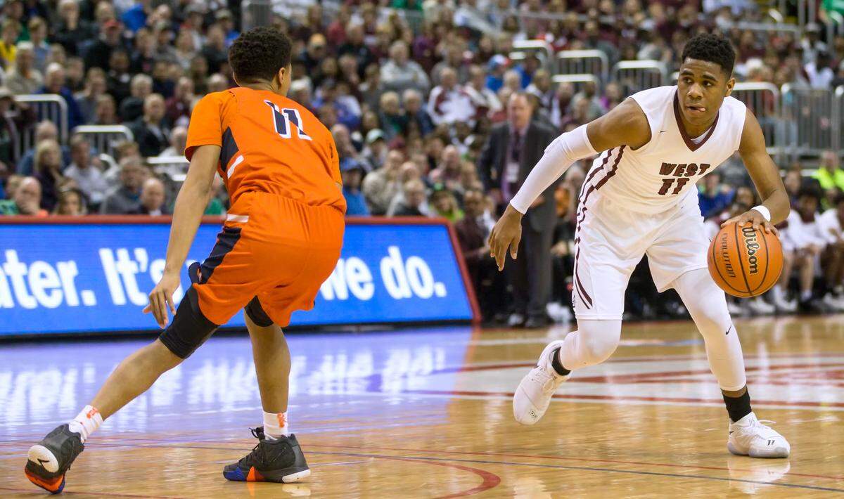 Belleville West’s Malachi Smith drives towards the basket during the 2018 IHSA Class 4A state championship game. The Maroons beat the Whitney Young Dolphins 60-56 in overtime to win their first state title. Smith now is playing for the Gonzaga Bulldogs in college.