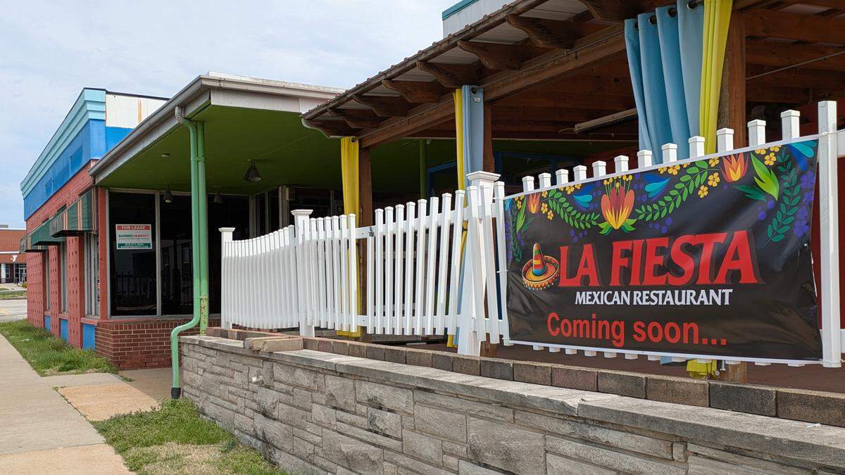 Signage announcing a new restaurant coming to Belleville